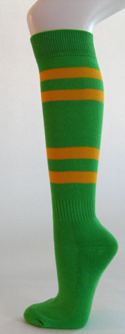 Bright green knee high softball socks with golden yellow stripes