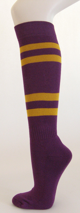 Purple knee high softball socks with golden yellow stripes