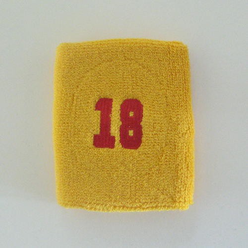 Number 18 eighteen golden mango yellow sweat wristband